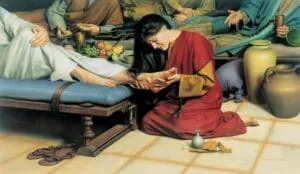donna bacia piedi di Gesù