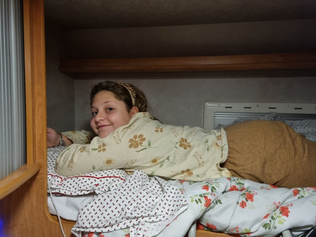 Francesca on a high bunk in the Pio camper in Foggia