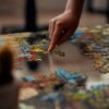 person holding jigsaw puzzle piece